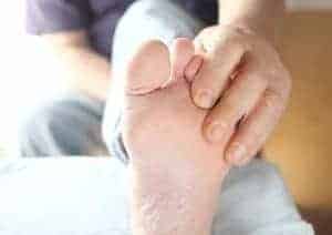 My FootDr Diabetes Fact Sheet - a hand touching feet